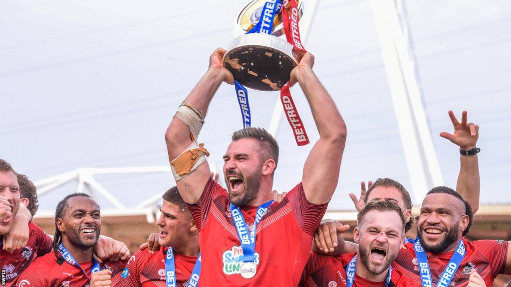 London Broncos lift the Championship Trophy after their victory over Toulouse Olympique promoting them to the Super League