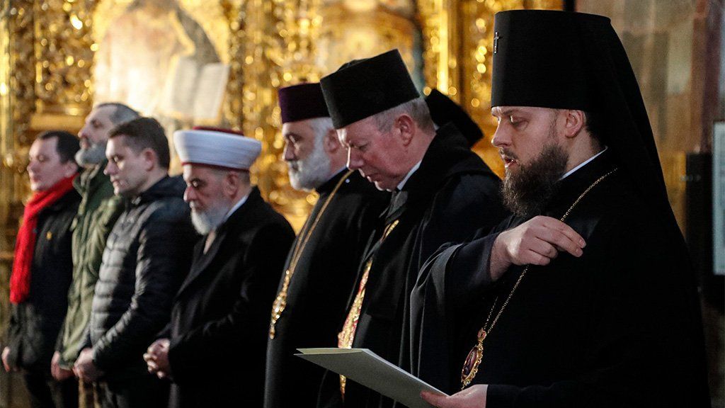 Members of the All-Ukrainian Council of Churches and Religious Organizations lead a prayer for peace inside St. Sophia Cathedral, Kyiv, 2 March 2022