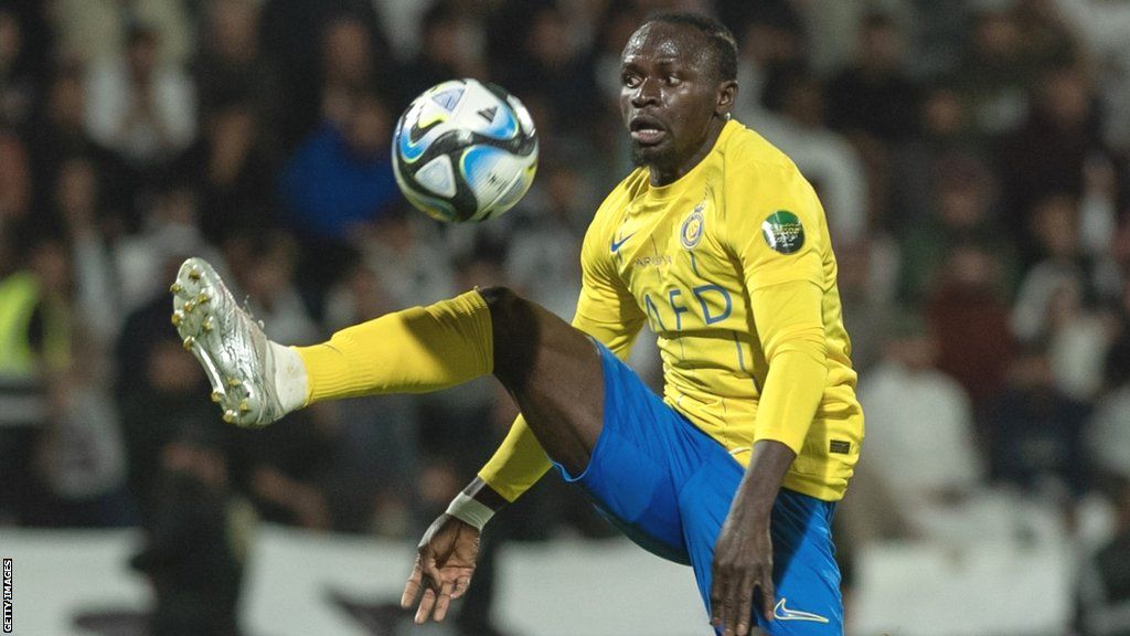 Sadio Mane lifts his right leg to control a high ball during a match for Saudi club Al Nassr