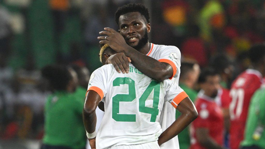 Franck Kessie consoles Simon Adingra after Ivory Coast lost 4-0 against Equatorial Guinea