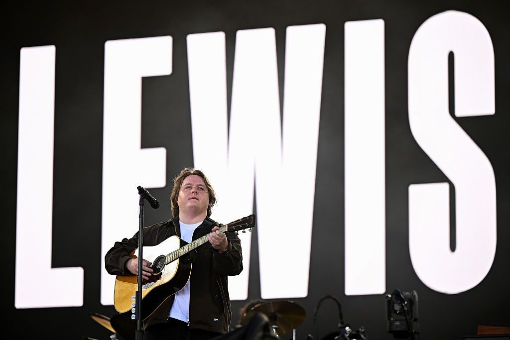 Lewis Capaldi plays the Pyramid Stage, against a backdrop showing his name in bold capital letters