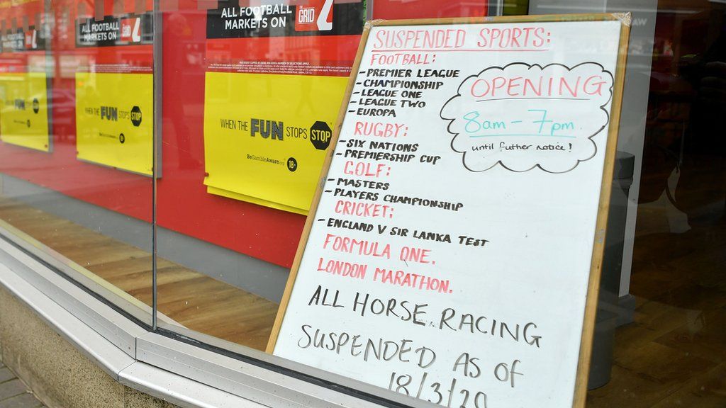 Suspended sport in a betting shop window
