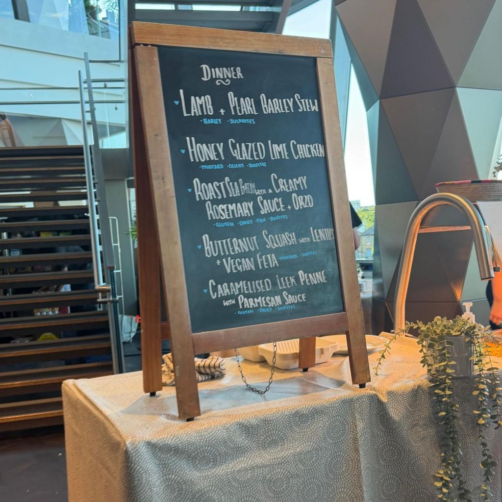 A chalkboard showing the menu options for crew and artists at Gorillaz' stadium show