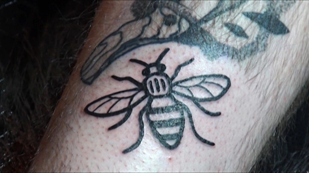 A bee tattoo.