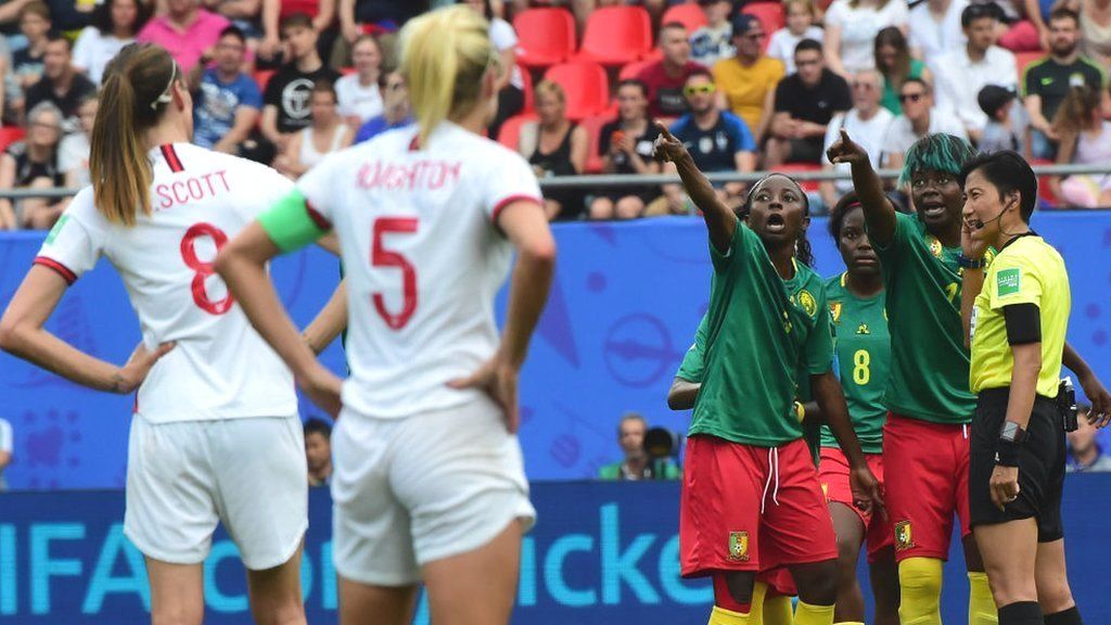 Cameroon players react to a VAR decision