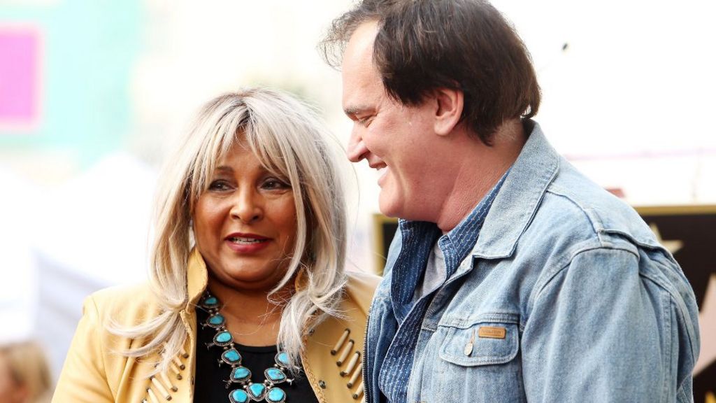 am Grier (L) and Quentin Tarantino attend the ceremony honoring Quentin Tarantino with a Star on The Hollywood Walk of Fame held on December 21, 2015 in Hollywood, California. 