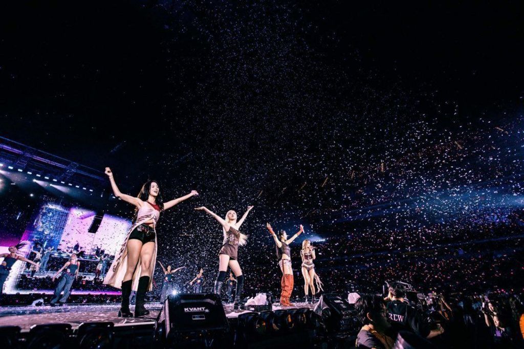 Blackpink are showered in confetti as they play a concert on their Deadline World Tour