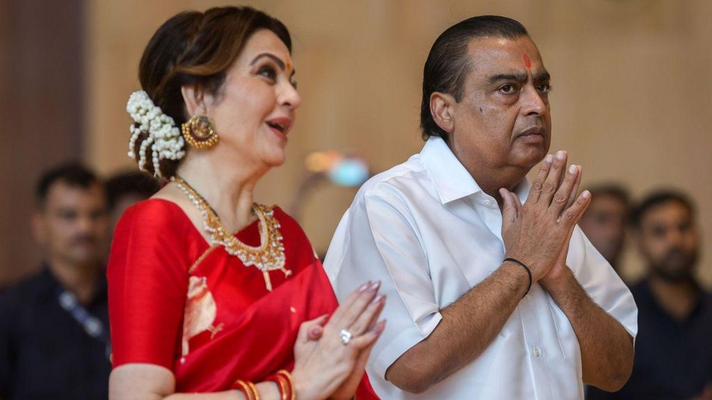 Reliance Industries chairman Mukesh Ambani (R) and his wife Neeta Ambani gesture during a mass wedding ceremony for underprivileged couples at Reliance Corporate Park, in Navi Mumbai, India, 02 July 2024