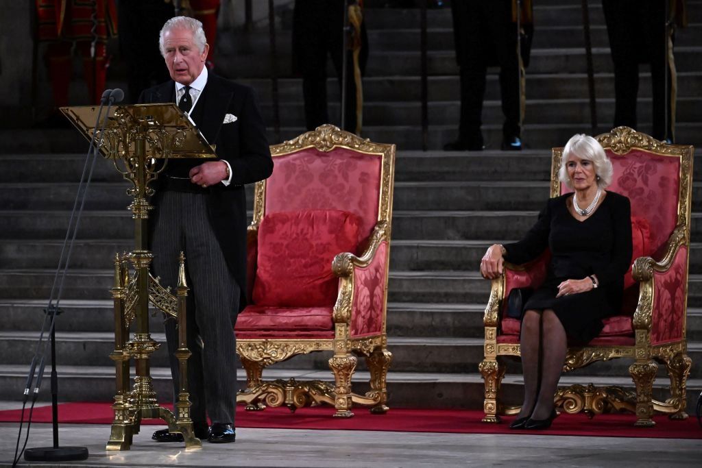Britain's King Charles III, flanked by Britain's Camilla, Queen Consort, speaks during the presentation of Addresses