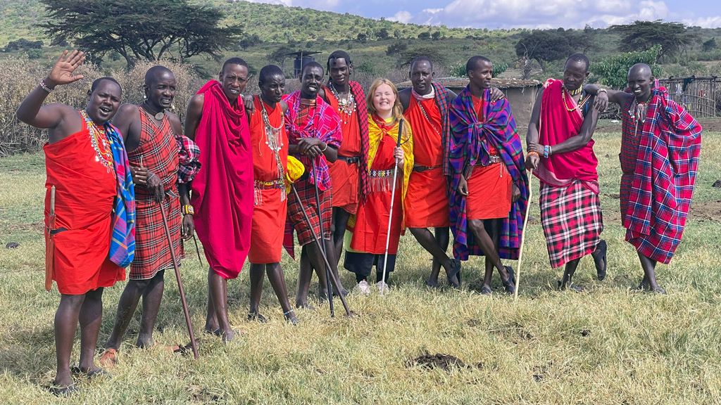 Lucy in Maasai dress with some of the villagers