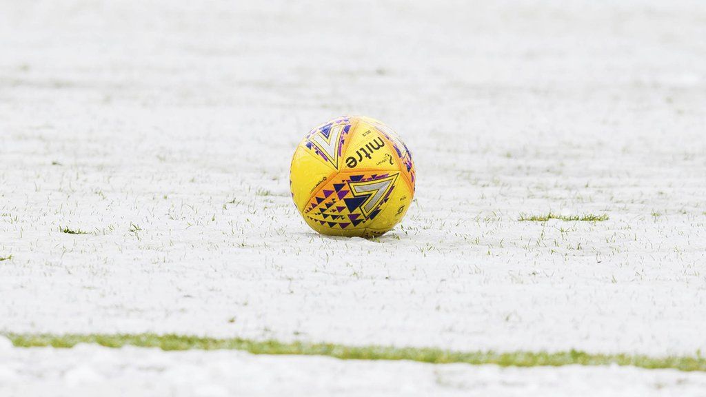 Snow on a football pitch