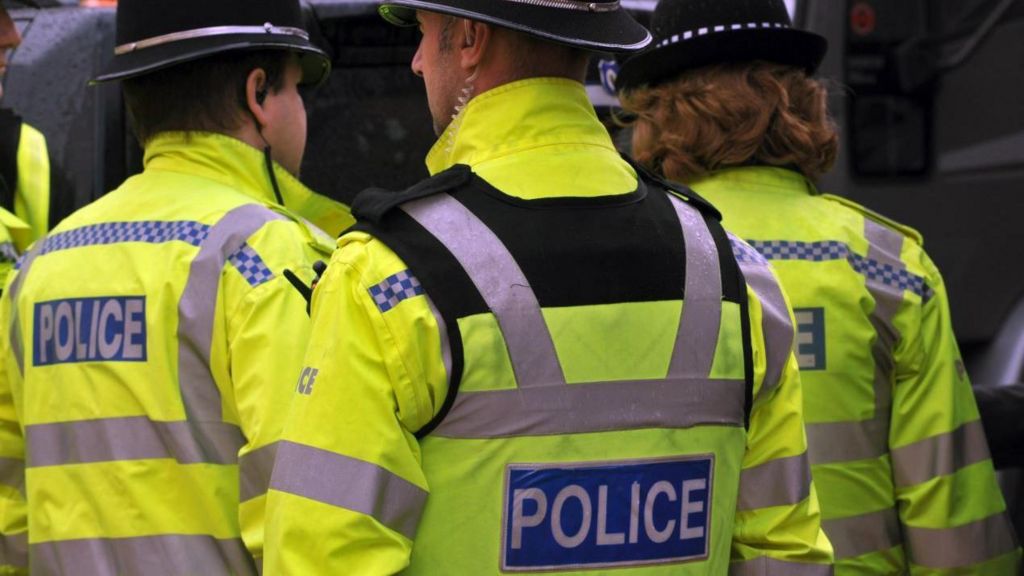 Police officers in high-vis jackets on patrol