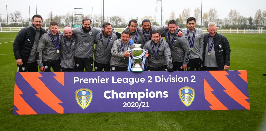Leeds United Under-23s coaching staff with the Premier League 2 Division 2 trophy