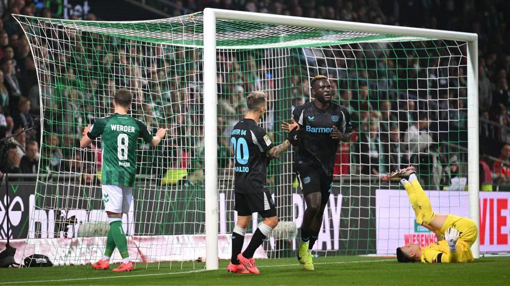 Bayer Leverkusen striker Victor Boniface celebrates scoring against Werder Bremen in the Bundesliga.