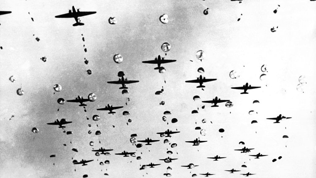 Allied planes and parachutes flying over Arnhem