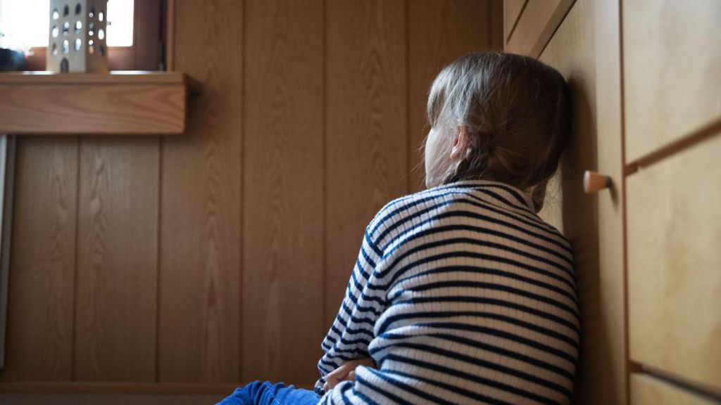 Stock picture of a girl staring at a window