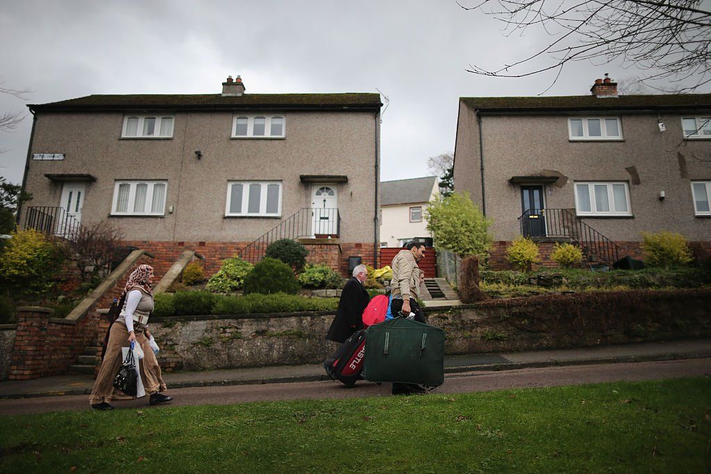 Photo of Syrian refugees arrive in the Isle of Bute in December 2015