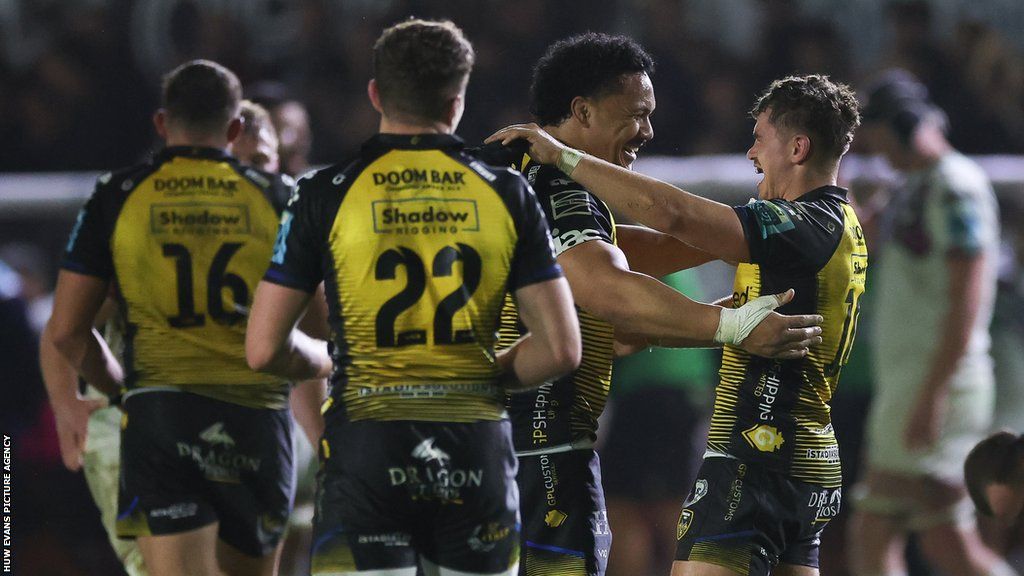 Dragons players celebrate win over Ospreys