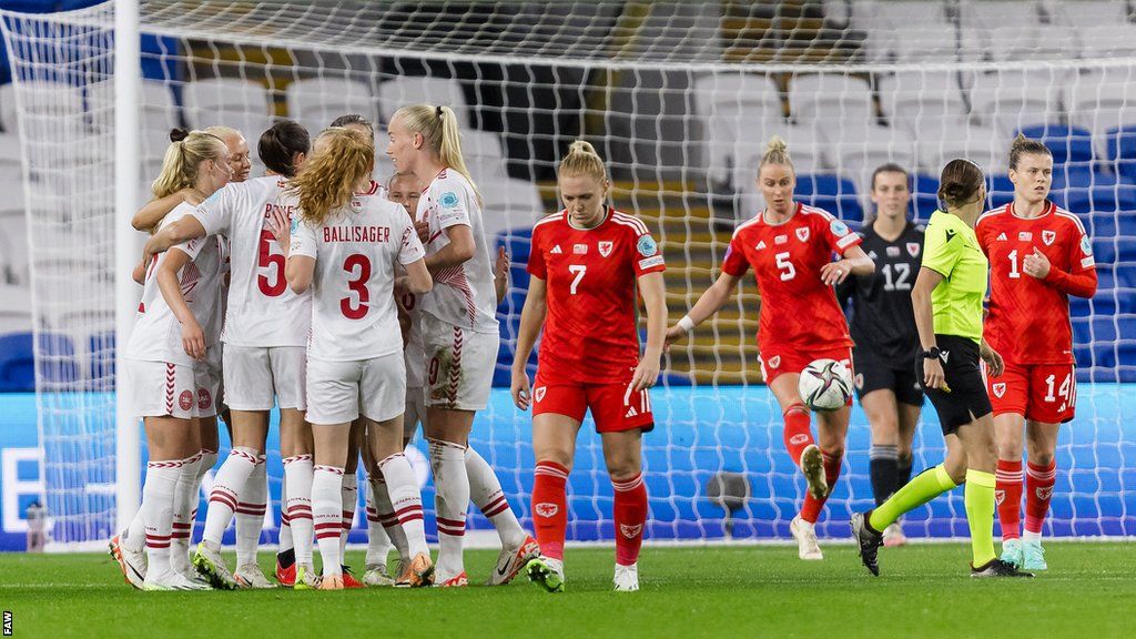 Denmark celebrate after Pernille Harder opened the scoring from the penalty spot