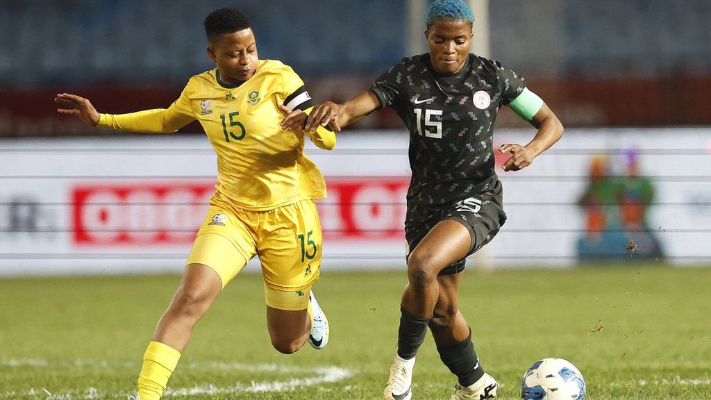 South Africa midfielder Refiloe Jane (left) vies for the ball with Nigeria midfielder Rasheedat Ajibade