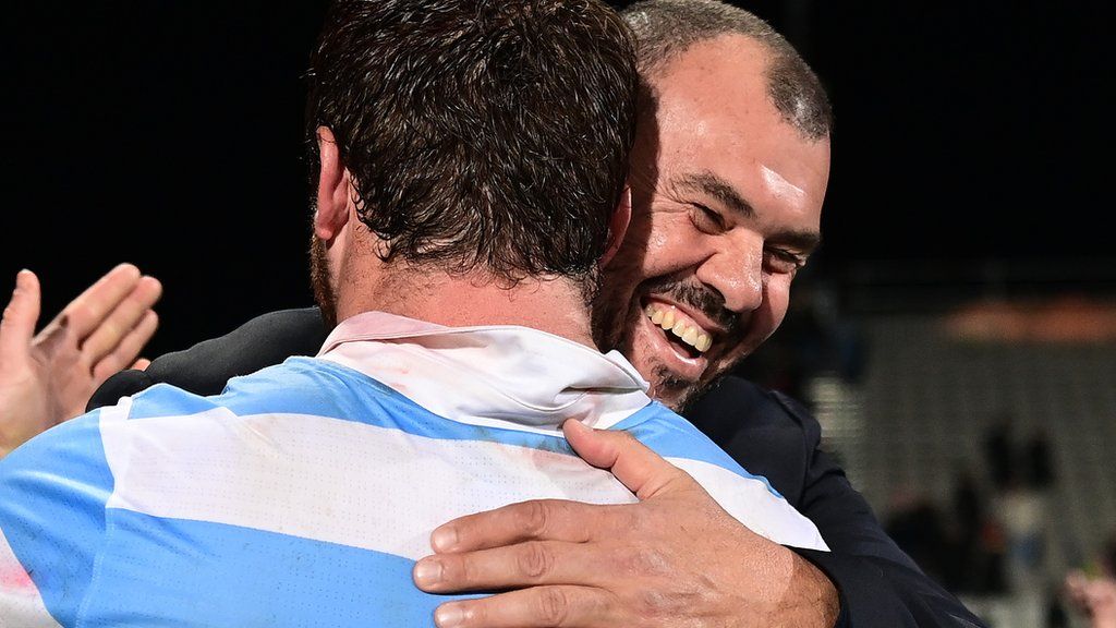 Michael Cheika hugs an Argentina rugby union player