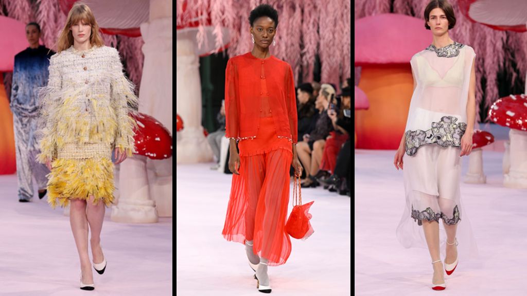 Three models on the pink Chanel runway - one wears a tweed-style raffia suit with yellow feathers, one a red chiffon suit jacket and long skirt, and the third a sheer long-line top and skirt with black and white embellishment