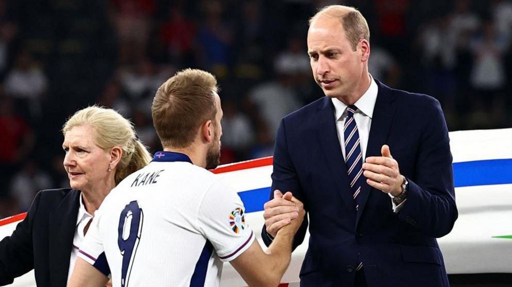 Prince William shakes hands with Harry Kane after the match