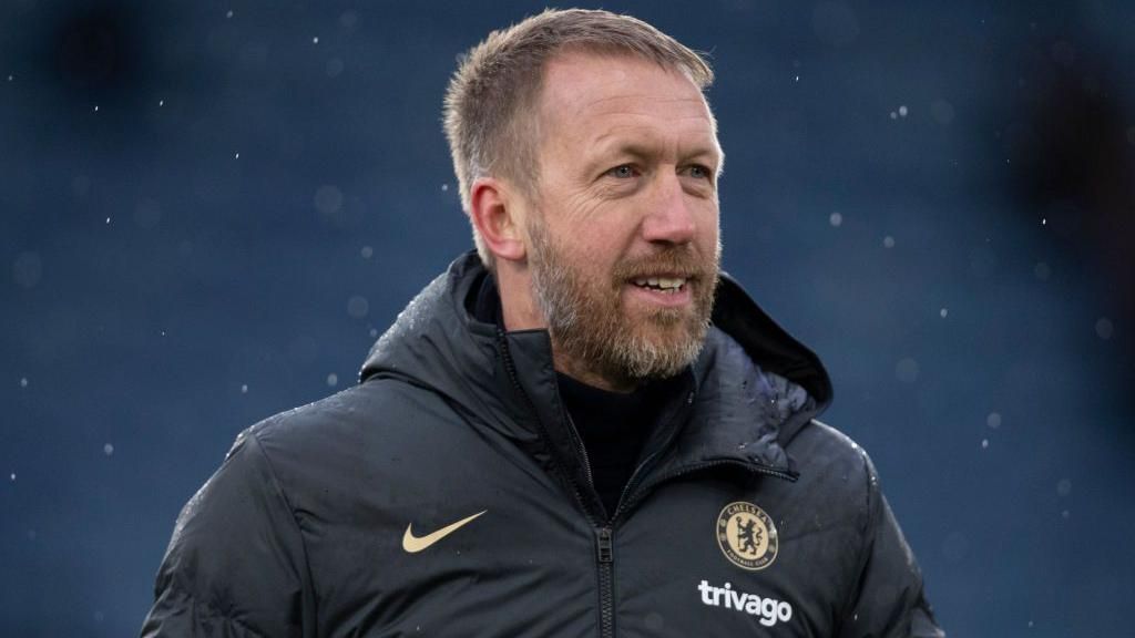 Graham Potter smiling in a Chelsea coat