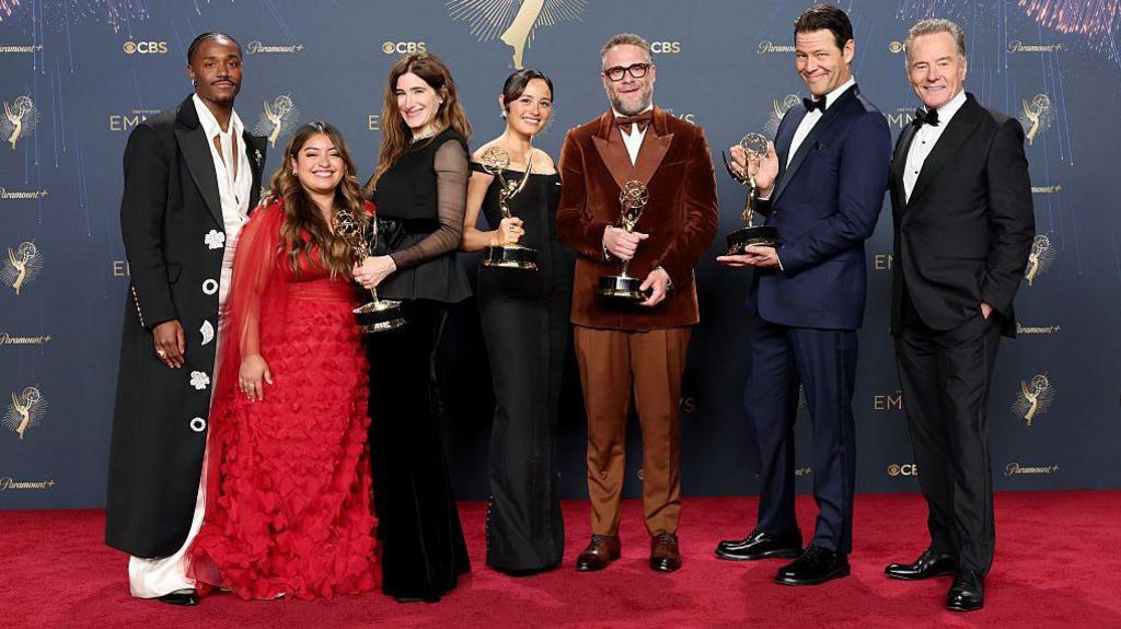 Dewayne Perkins, Keyla Monterroso Mejia, Kathryn Hahn, Chase Sui Wonders, Seth Rogen, Ike Barinholtz and Bryan Cranston, winners of Outstanding Comedy Series, Outstanding Writing For a Comedy Series, Lead Actor in a Comedy Series, and Outstanding Guest Actor in a Comedy Series, pose in the press room during the 77th Primetime Emmy Awards at Peacock Theater