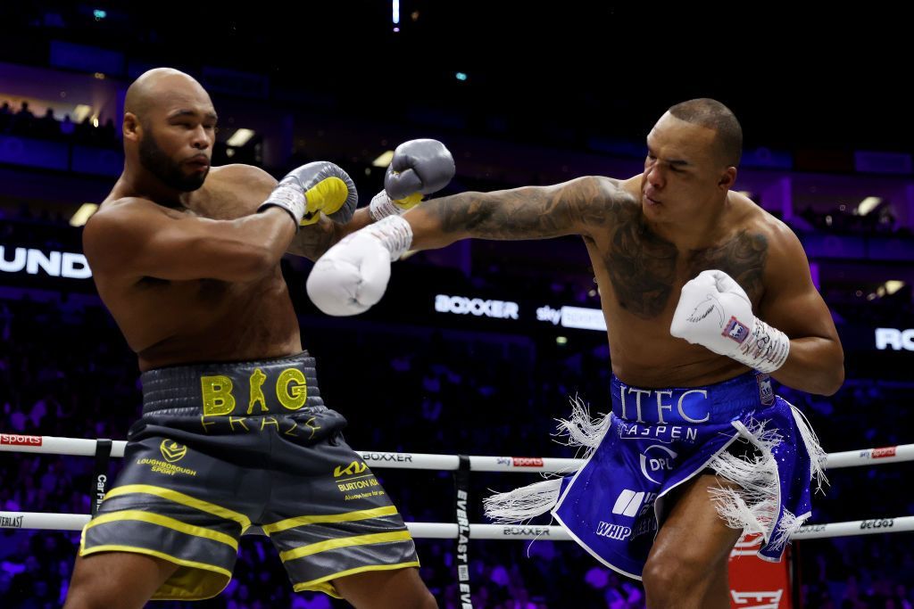 Fabio Wardley throws a right hand at Frazer Clarke during their bout