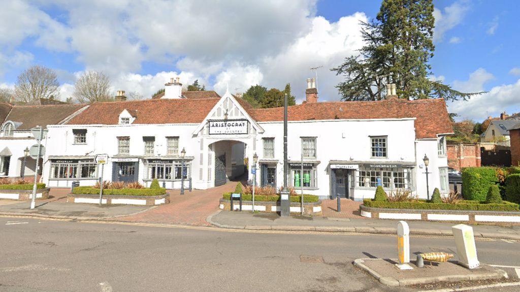 The Chantry on Hadham Road, Bishop's Stortford - a white-fronted two-storey building with a central archway with shops on its ground floor