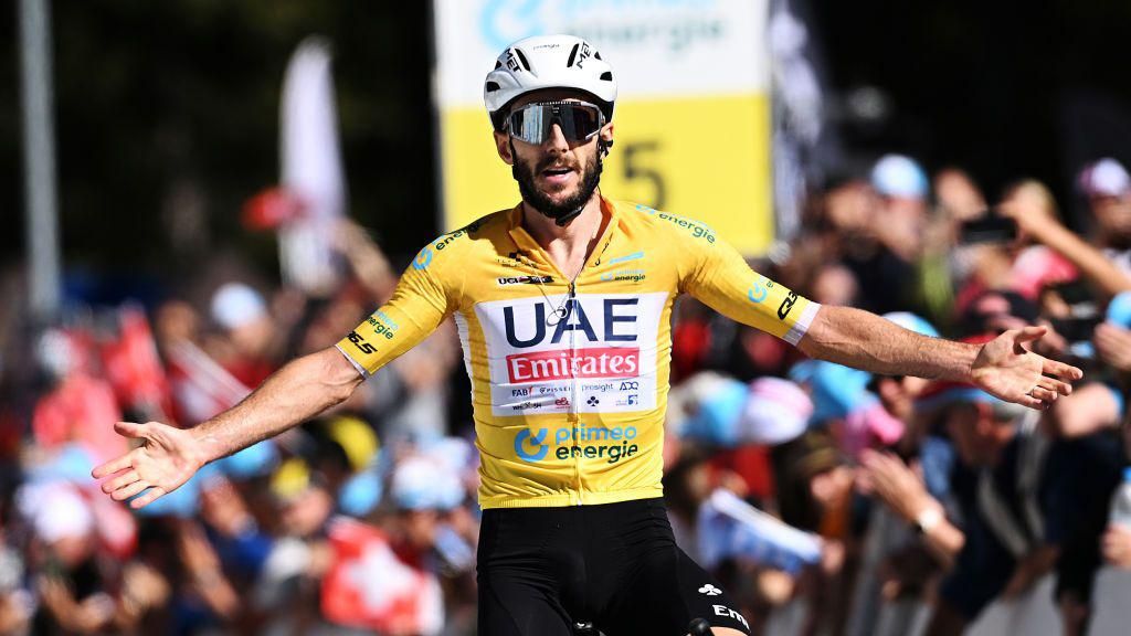 Adam Yates with arms out wide in a celebration pose