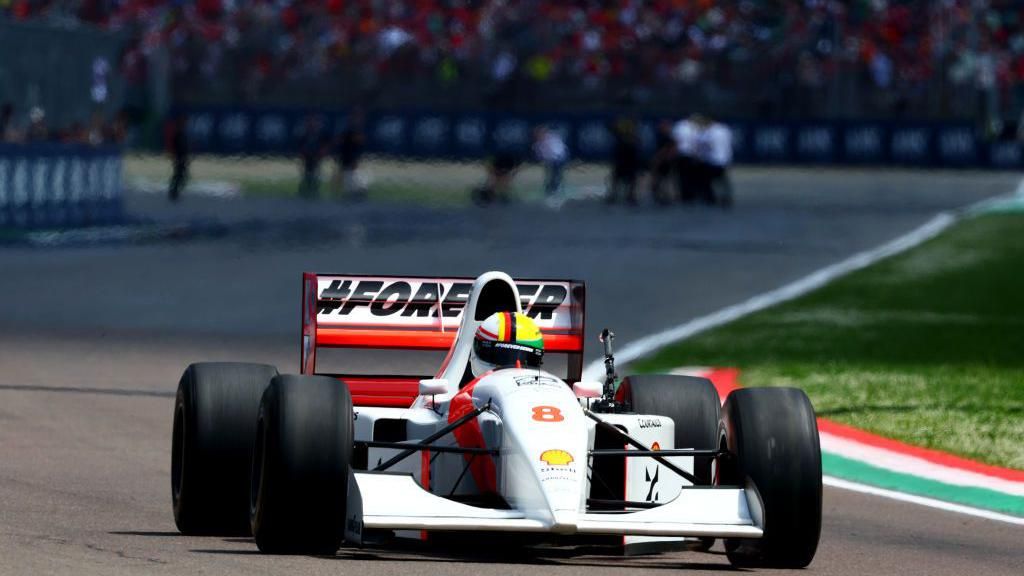 Sebastian Vettel driving Ayrton Senna's 1993 McLaren at Imola