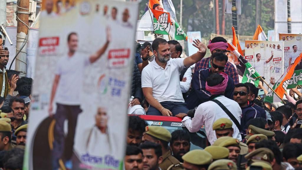 India's Congress party leader Rahul Gandhi waves to supporters from atop a vehicle during the 'Bharat Jodo Yatra' roadshow in Varanasi on February 17, 2024. (Photo by Niharika KULKARNI / AFP) (Photo by NIHARIKA KULKARNI/AFP via Getty Images)