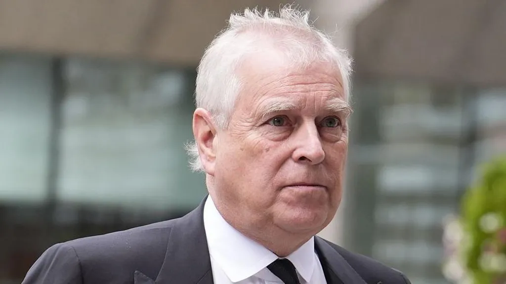 Andrew Mountbatten-Windsor is seen in a black suit.