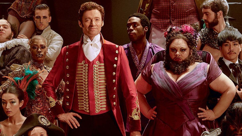 Hugh Jackman with Keala Settle and other cast members from The Greatest Showman