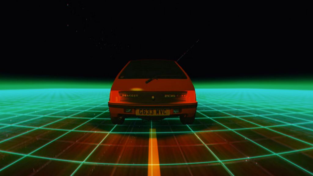 A red G-reg Peugeot 205 on a green digital grid is part of the the VR experience