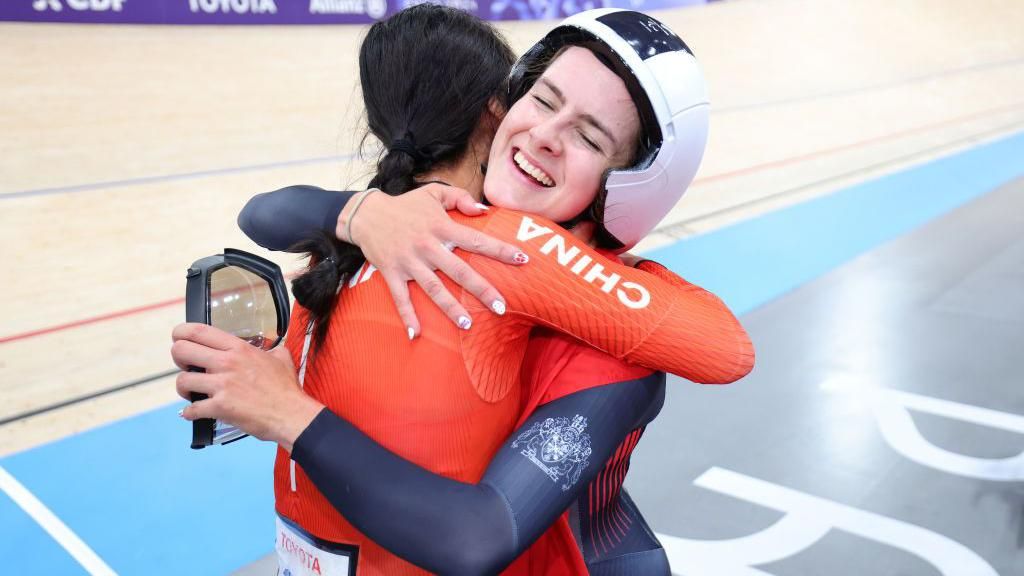 GB's Daphne Schrager embraces China's Xiaomei Wang 