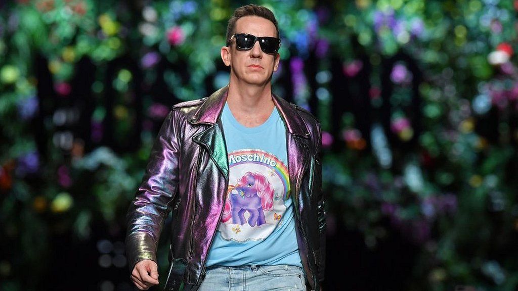 US desginer Jeremy Scott greets the audience at the end of the show for fashion house Moschino during the Women's Spring/Summer 2018 fashion shows in Milan, on September 21, 2017