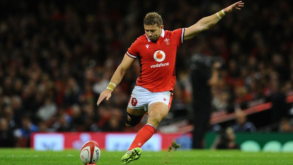 Leigh Halfpenny kicks a conversion attempt for Wales