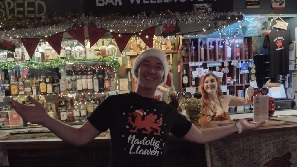 Two employees of the pub at Christmas