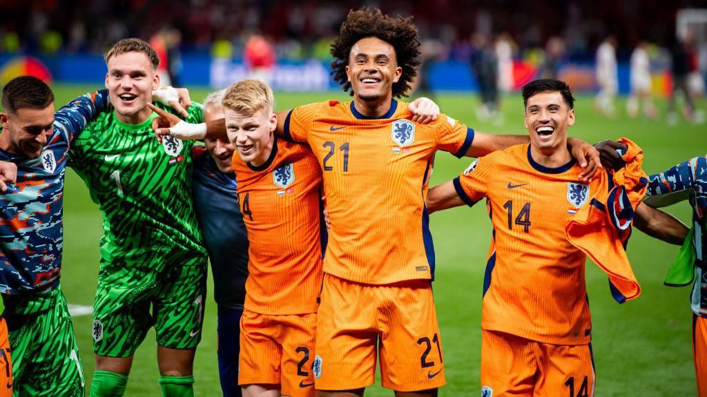 Joshua Zirkzee hugs team-mates after playing for the Netherlands