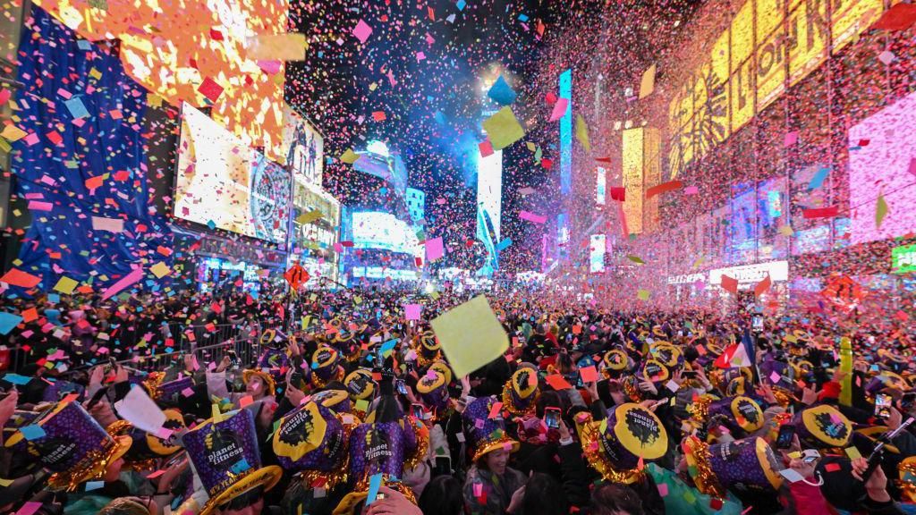 Revelers celebrate New Year’s Eve in Times Square as confetti falls on January 01, 2023 in New York City. 