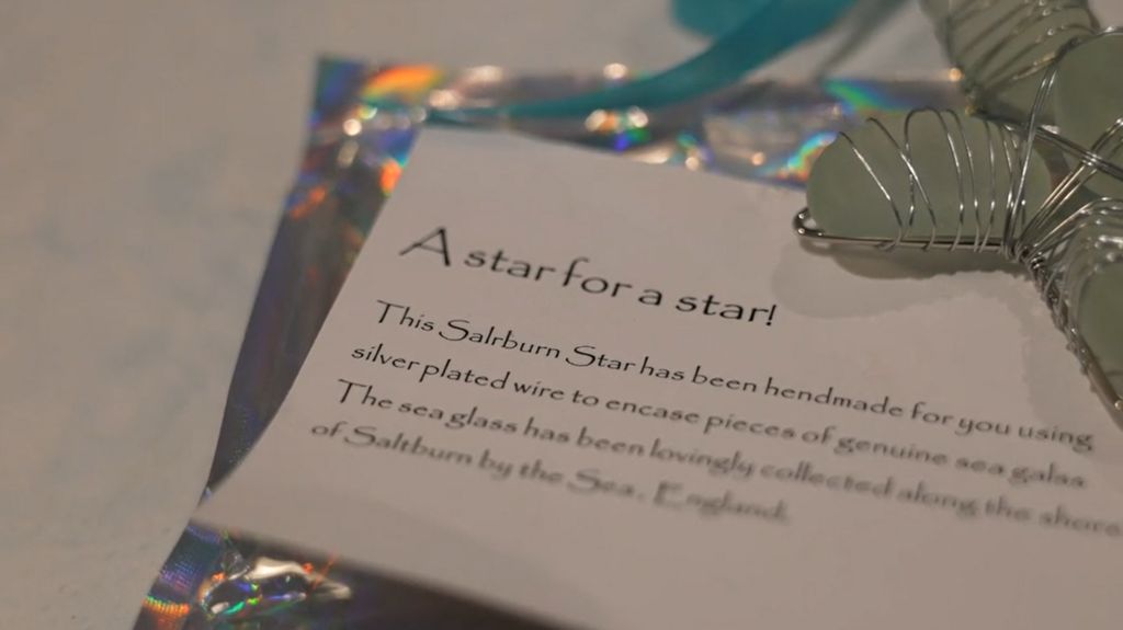 Sea glass star and an information card