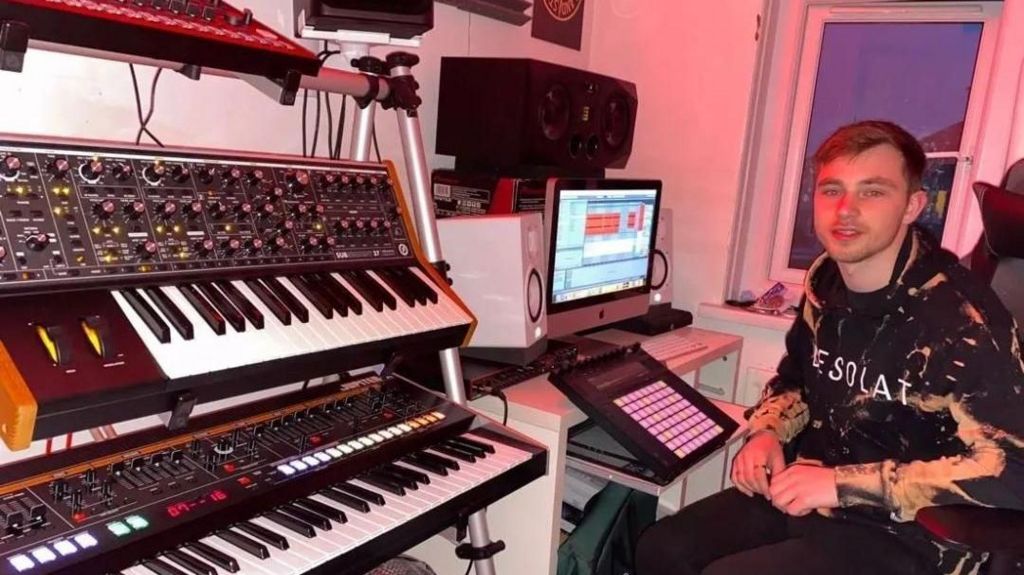 Nath Brown mixes his tracks in his home studio