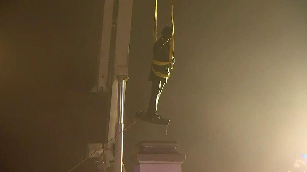 A Confederate statue is removed.