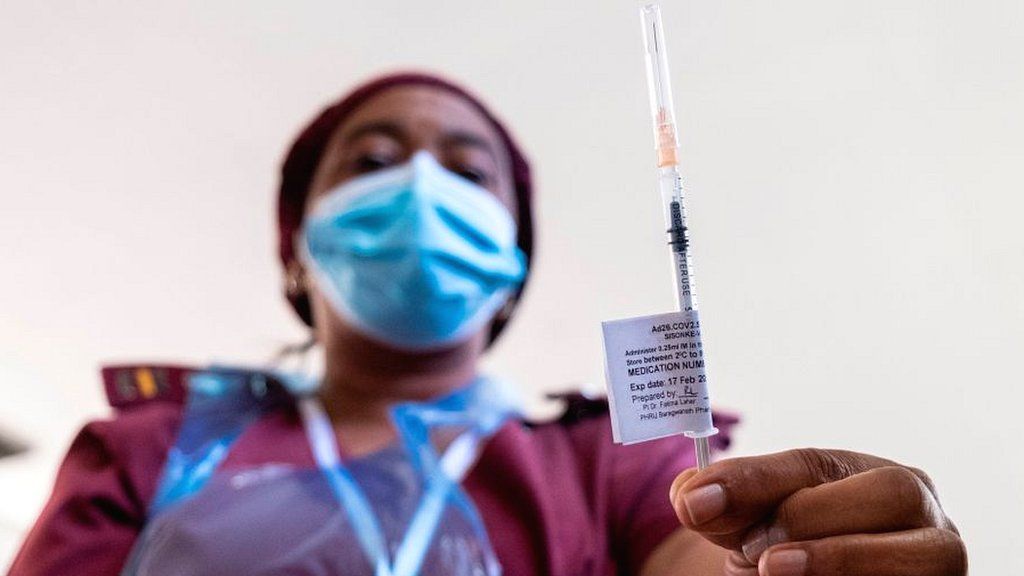 A health work with vaccine needled in Soweto