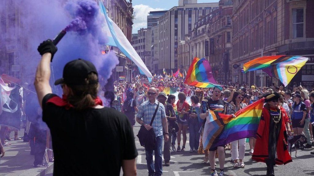 A purple flare set of at the pride march