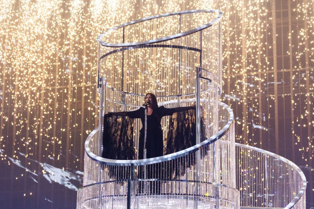 Yuval Raphael sings for Israel with her arms outstretched at the 2025 Eurovision Song Contest