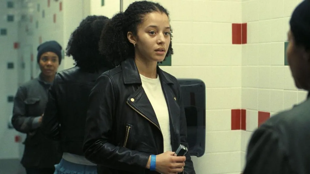 Chase Infiniti and Regina Hall standing in a bathroom, in one scene from One Battle After Another